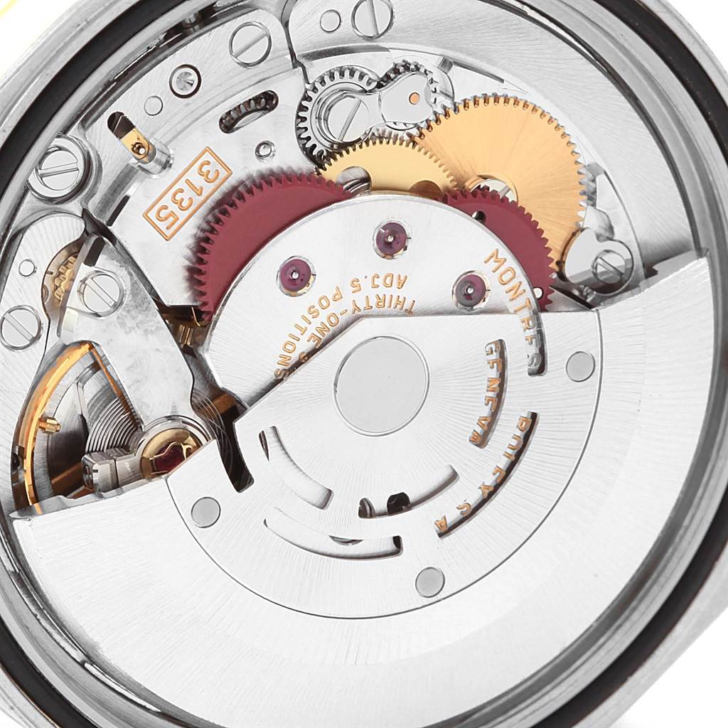 This image shows a close-up of the inner mechanical movement of a Rolex Datejust 16233 Men's Steel and Gold (two tone) Silver Dial 16233 Men's Steel and Gold (two tone) Silver Dial watch.