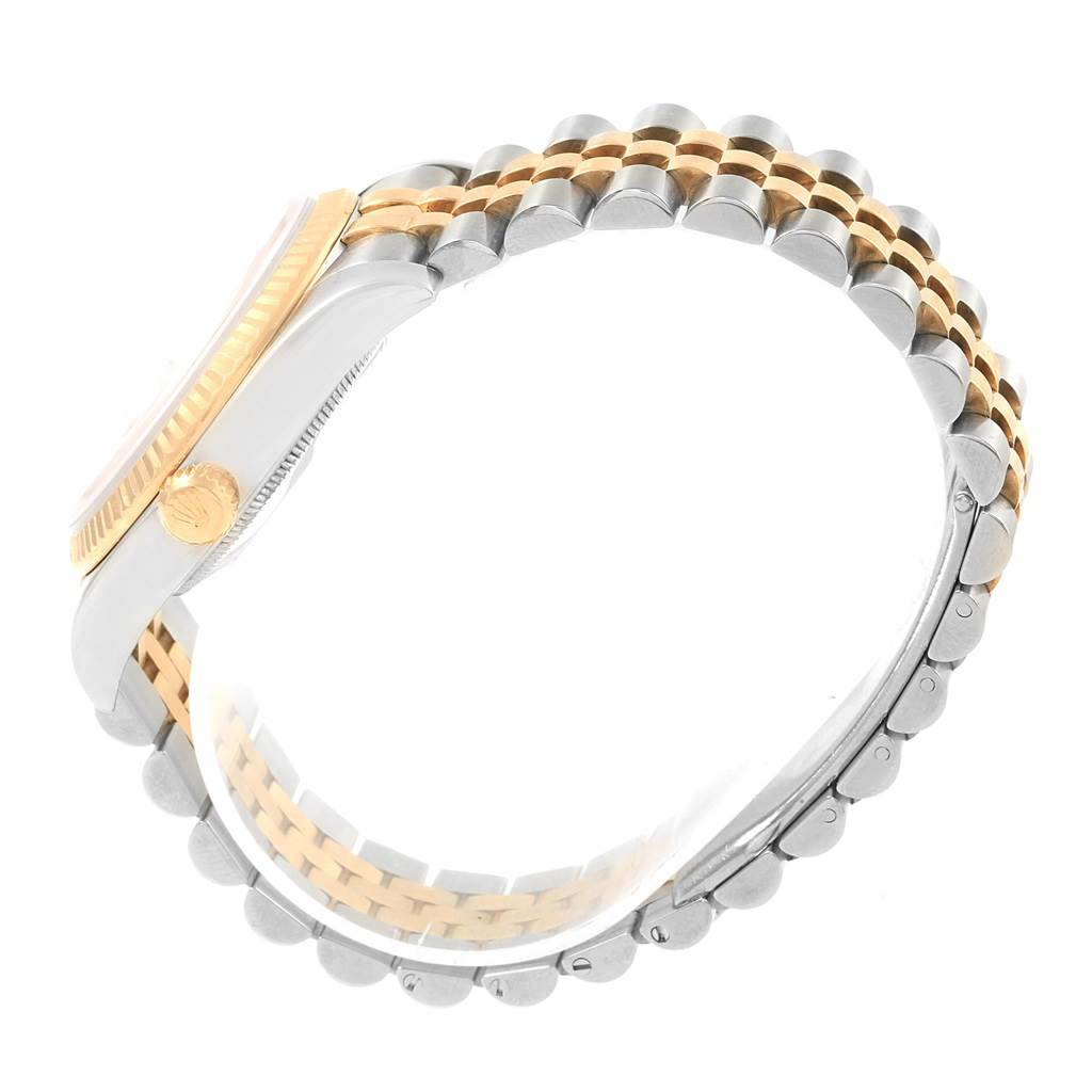 The image shows a side view of a Rolex Datejust 116233 Men's Stainless Steel White Dial 116233 Men's Stainless Steel White Dial watch, highlighting the crown, case, and two-tone jubilee bracelet.