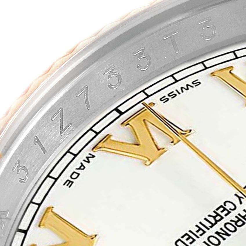 This close-up image shows part of the dial and bezel edge of a Rolex Datejust 116233 Men's Stainless Steel White Dial 116233 Men's Stainless Steel White Dial watch, including some serial numbers.