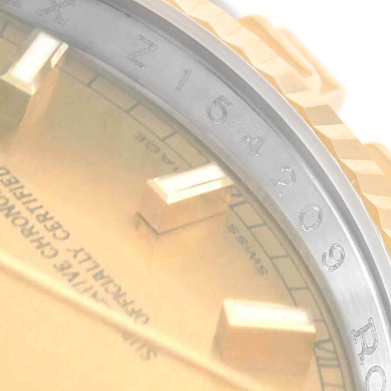The image shows a close-up view of the Rolex Datejust 116233 Men's Stainless Steel Champagne Dial 116233 Men's Stainless Steel Champagne Dial watch dial, bezel, and part of the case with a visible serial number.