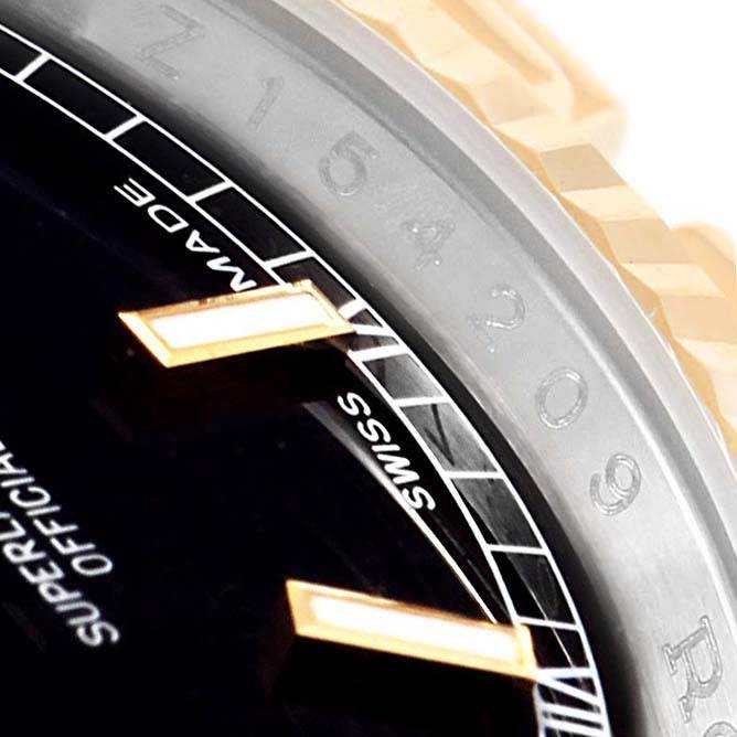 This close-up image of a Rolex Datejust 116233 Men's Stainless Steel Black Dial 116233 Men's Stainless Steel Black Dial watch shows the detailed dial, markers, and part of the bezel.