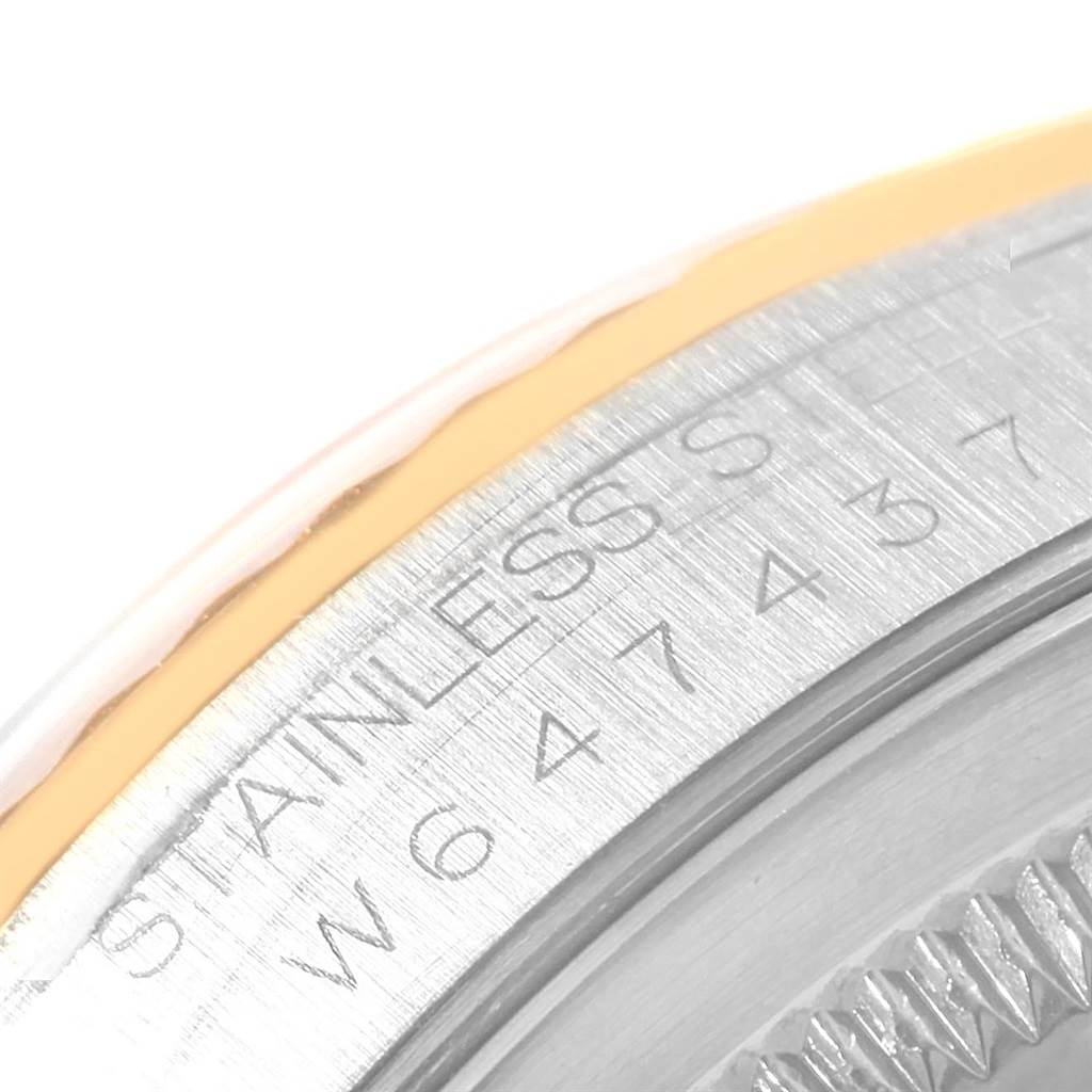 This image shows a close-up of the engraved engraving of Rolex Datejust 16233 Men's Steel and Gold (two tone) Beige Dial 16233 Men's Steel and Gold (two tone) Beige Dial model with "STAINLESS STEEL" visible.