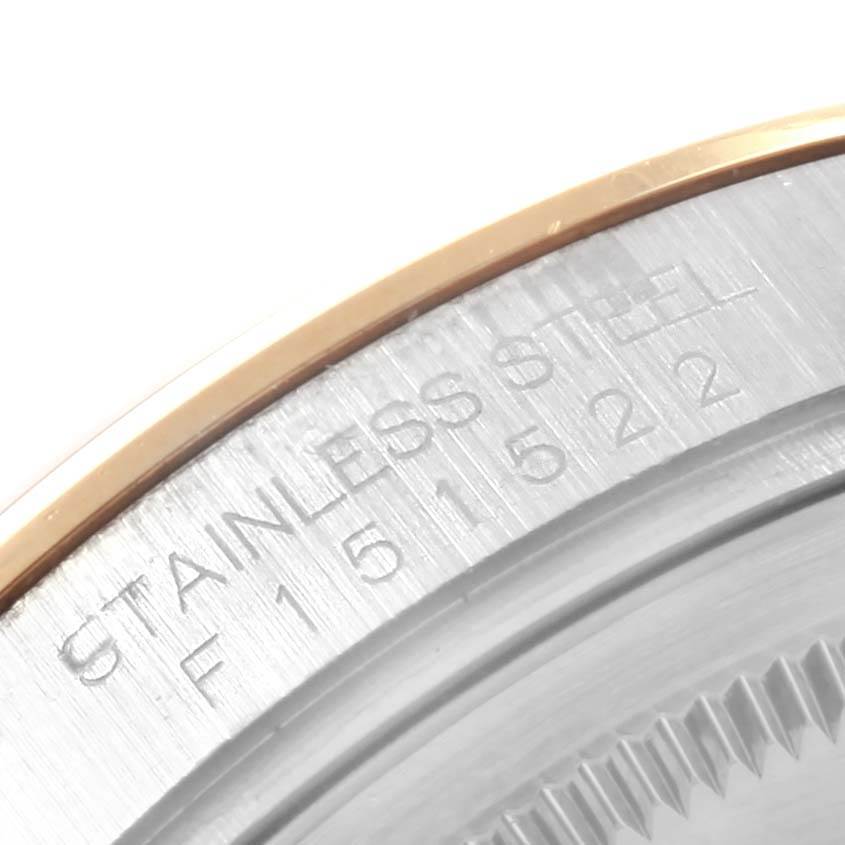 This close-up shows the stainless steel and serial number details on the side of a Rolex Datejust 116203 Men's Stainless Steel White Dial 116203 Men's Stainless Steel White Dial watch case.