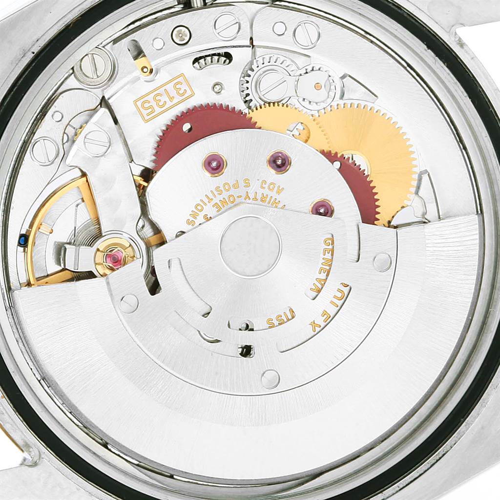 The image shows the inner mechanism of a Rolex Datejust 116203 Men's Stainless Steel White Dial 116203 Men's Stainless Steel White Dial watch, focusing on its movement parts from a top-down angle.