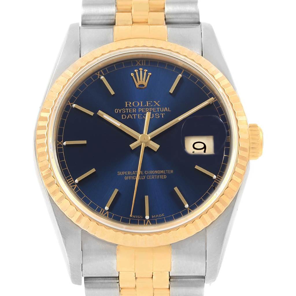 This image shows a frontal view of a Rolex Datejust 16233 Men's Steel and Gold (two tone) Blue Dial 16233 Men's Steel and Gold (two tone) Blue Dial watch highlighting its blue dial, gold fluted bezel, and two-tone bracelet.