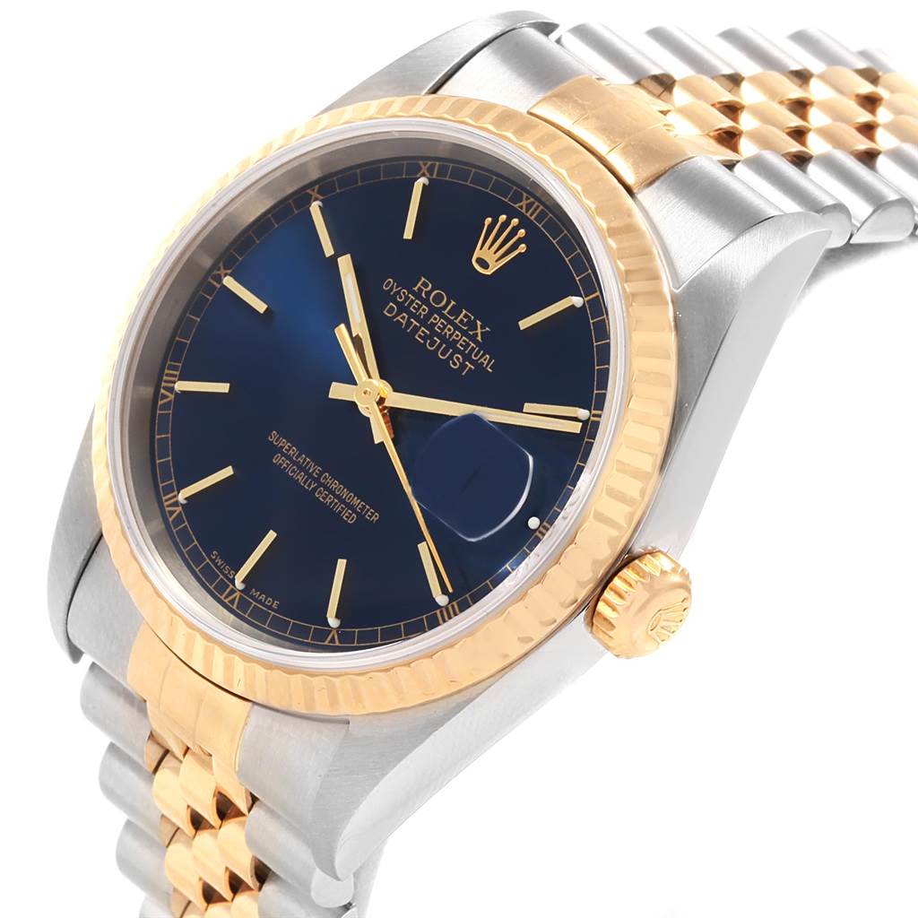 The Rolex Datejust 16233 Men's Steel and Gold (two tone) Blue Dial 16233 Men's Steel and Gold (two tone) Blue Dial watch is shown at an angle highlighting the dial, fluted bezel, crown, and part of the Jubilee bracelet.