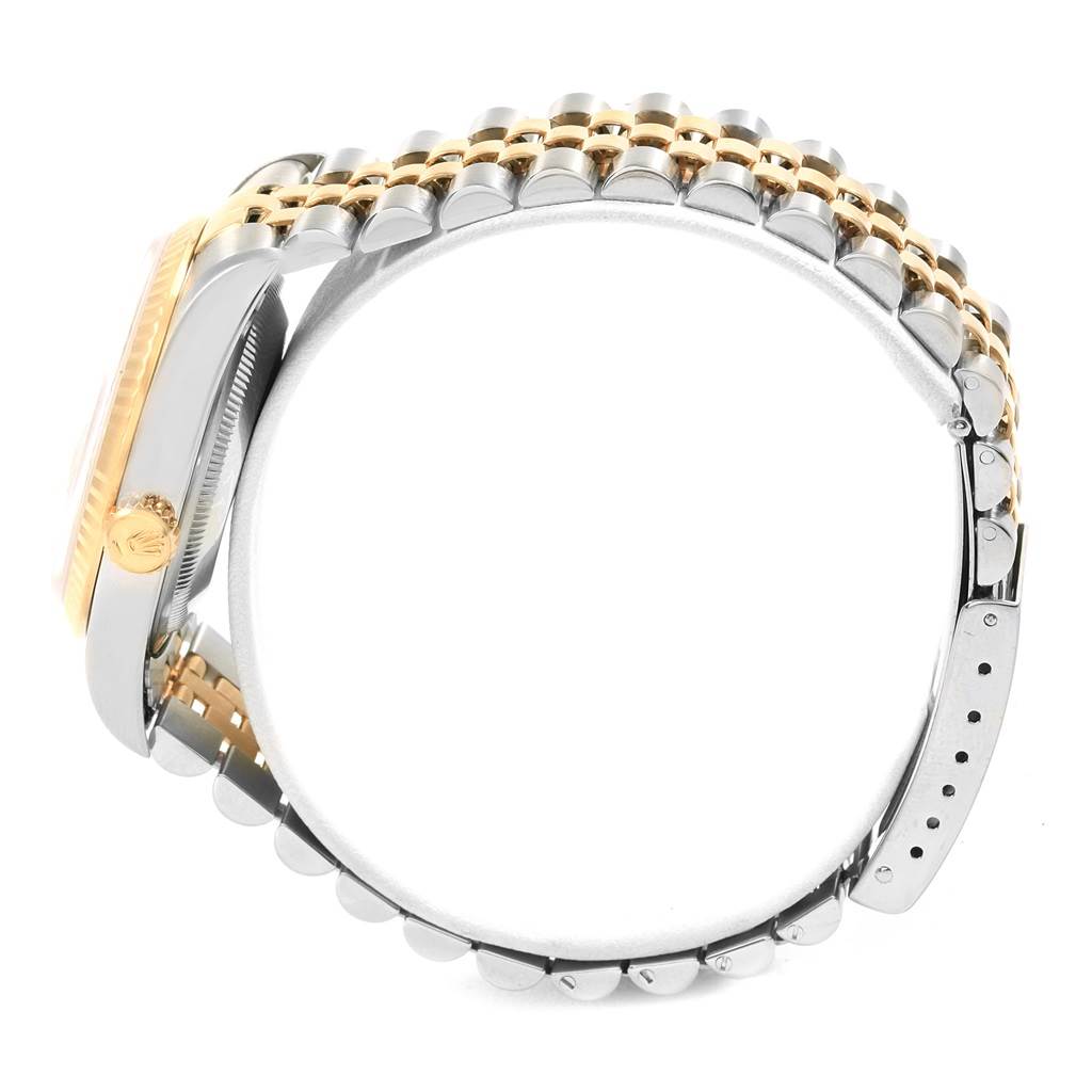 The image shows a side view of the Rolex Datejust 16233 Men's Steel and Gold (two tone) Champagne Dial 16233 Men's Steel and Gold (two tone) Champagne Dial watch, highlighting the crown, case, and bracelet.