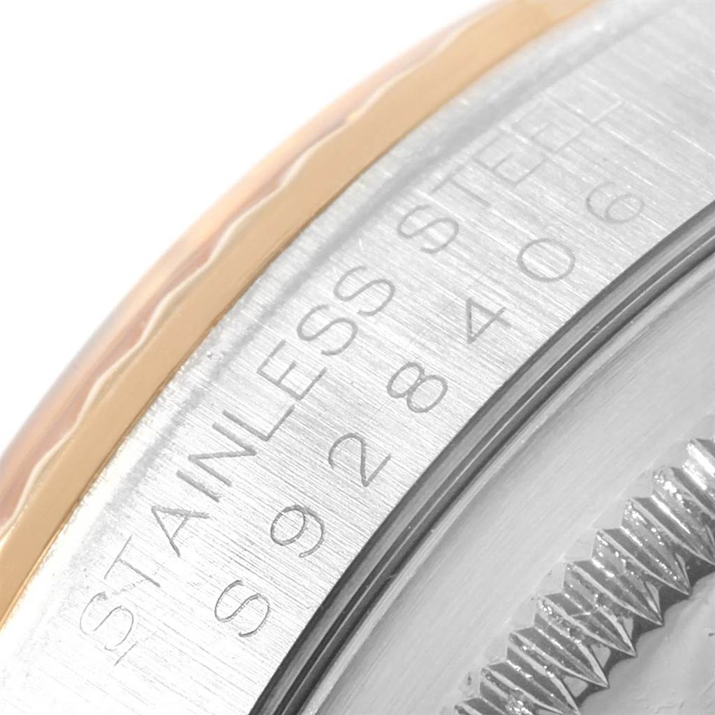 This image shows a close-up of the stainless steel case and bezel edge with the serial number of the Rolex Datejust 16233 Men's Steel and Gold (two tone) Champagne Dial 16233 Men's Steel and Gold (two tone) Champagne Dial.