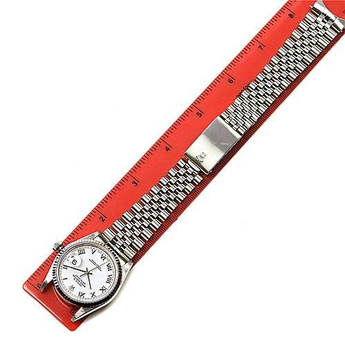 The Rolex Datejust 16234 Men's Stainless Steel White Dial 16234 Men's Stainless Steel White Dial watch is shown laid flat inside a red ruler, displaying the watch face, bracelet, and clasp.