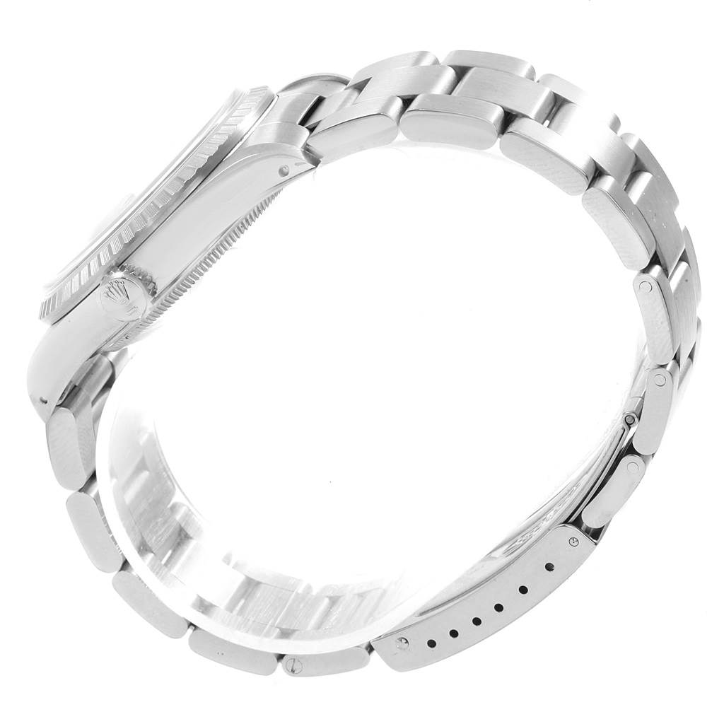 This is a side view of a Rolex Datejust 16220 Men's Stainless Steel Silver Dial 16220 Men's Stainless Steel Silver Dial model showcasing its bracelet, crown, and part of the case.