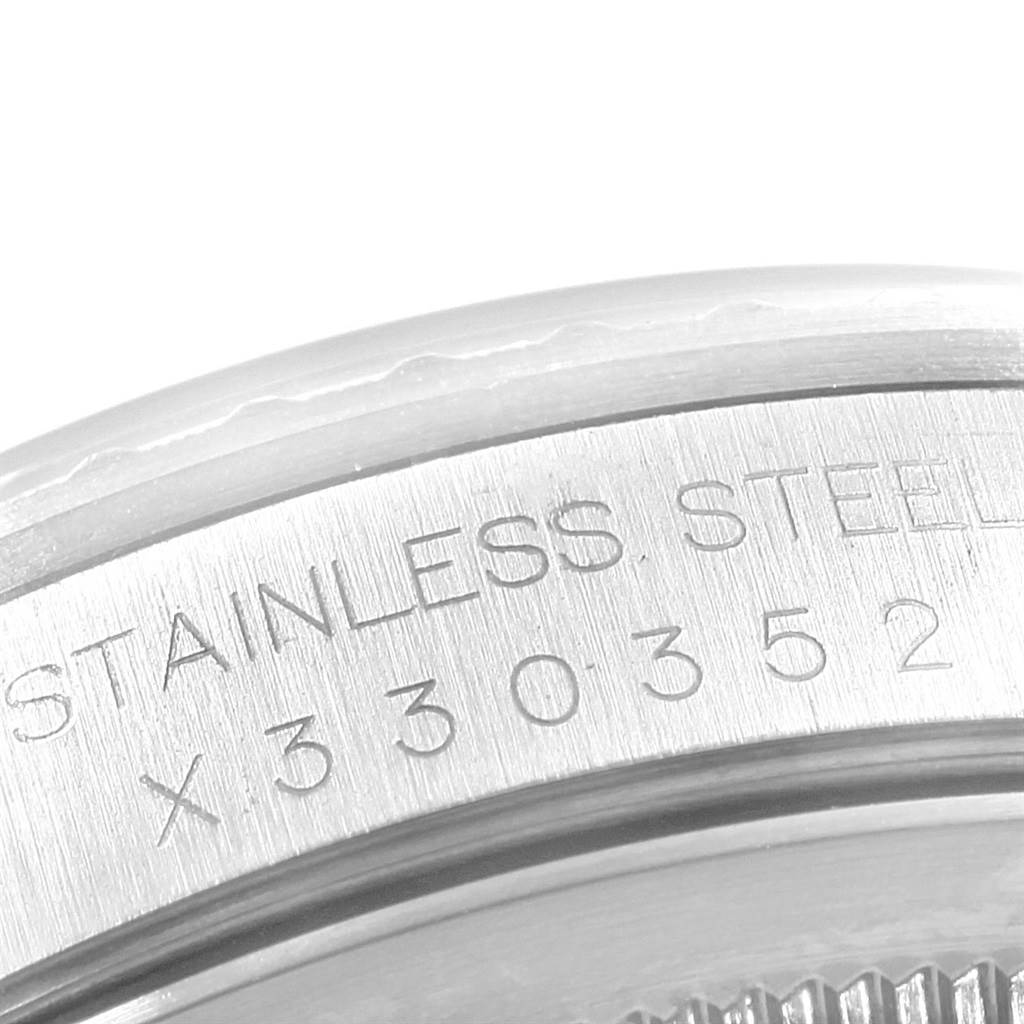 This close-up image shows the stainless steel case back and serial number engraving of a Rolex Datejust 16220 Men's Stainless Steel Silver Dial 16220 Men's Stainless Steel Silver Dial watch.