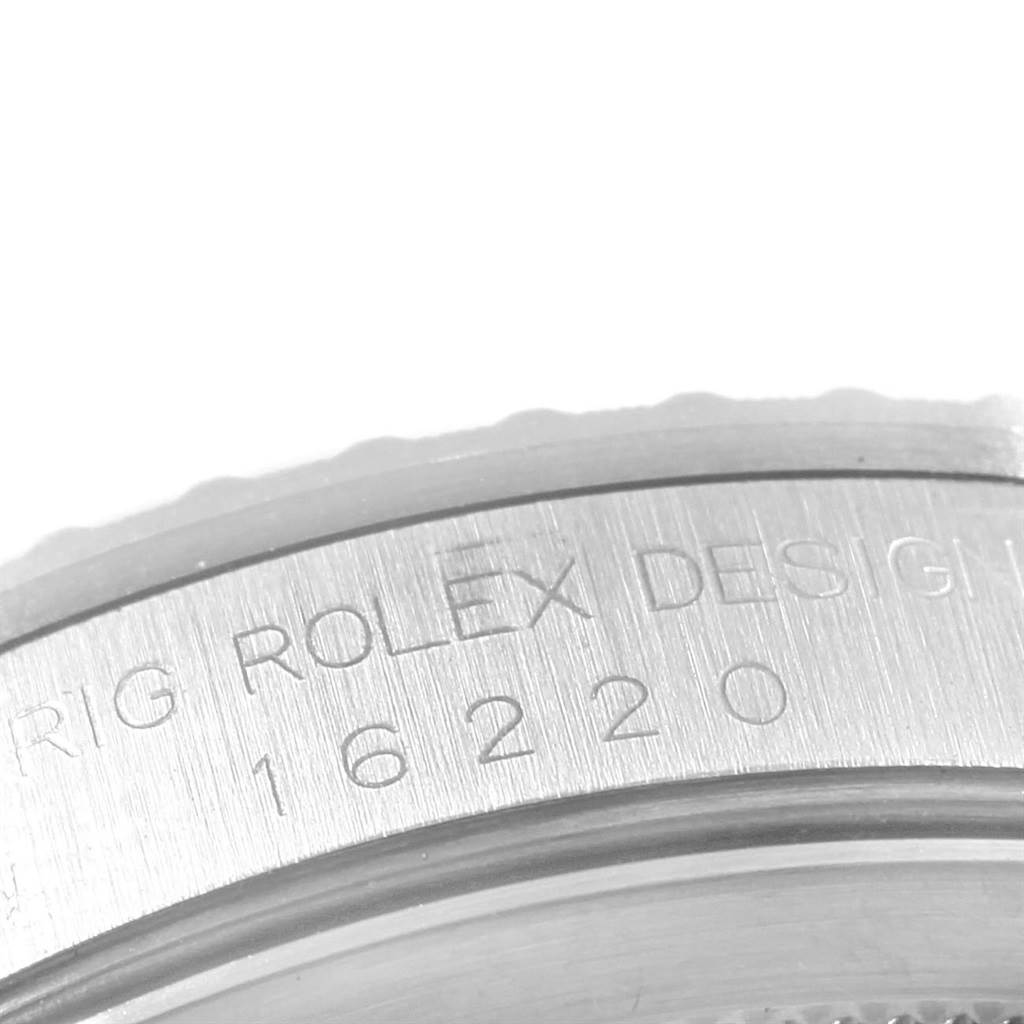 The image shows a close-up of the side of a Rolex Datejust 16220 Men's Stainless Steel Silver Dial 16220 Men's Stainless Steel Silver Dial watch case with the model number 16220 etched in.