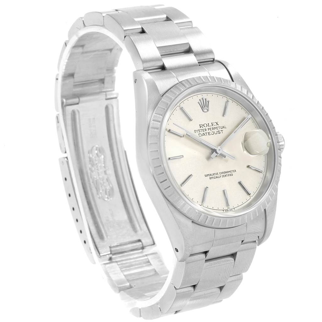 The Rolex Datejust 16220 Men's Stainless Steel Silver Dial 16220 Men's Stainless Steel Silver Dial watch is shown from an angled side view, highlighting the dial, bezel, and part of the metal bracelet.