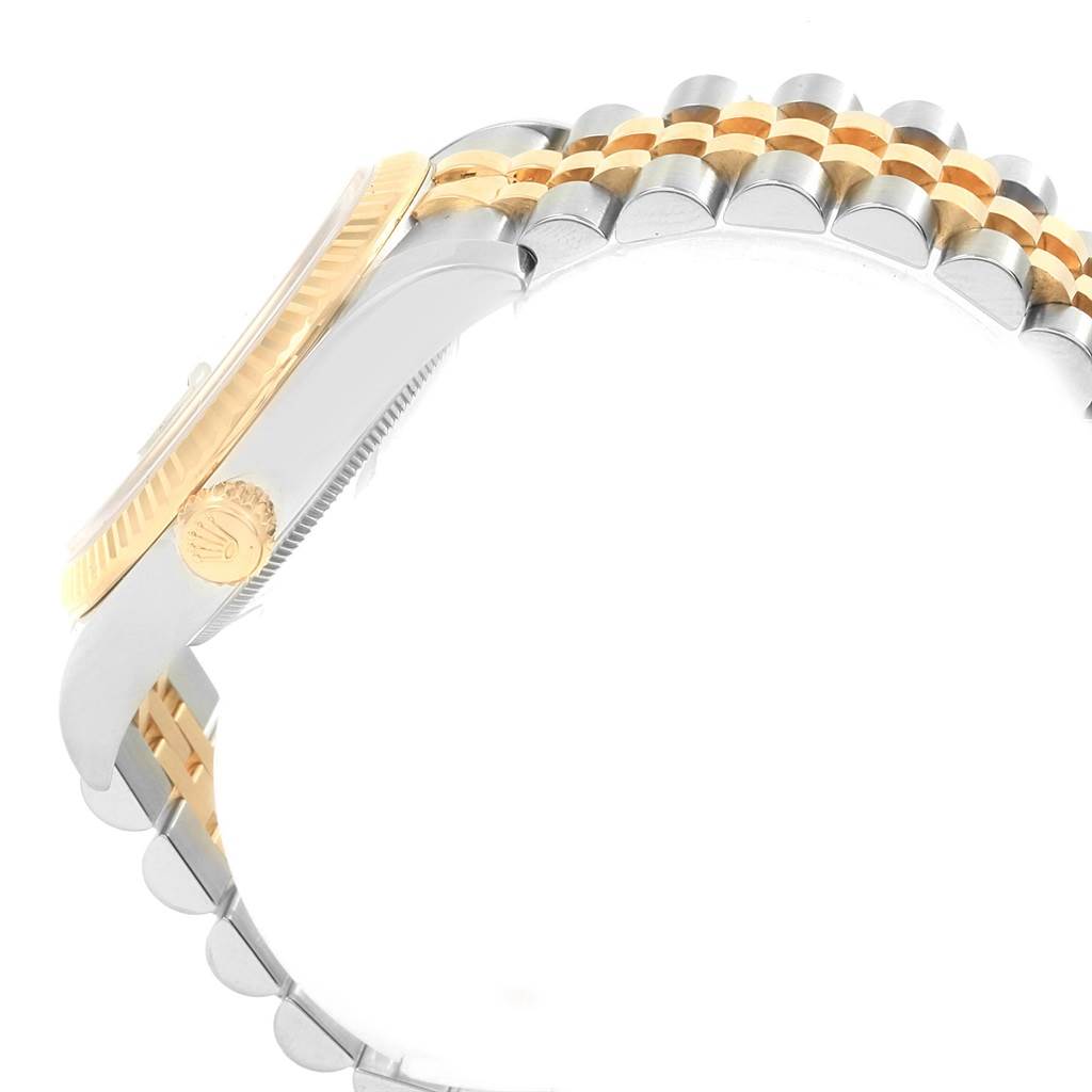 This image shows a side view of a Rolex Datejust 116233 Men's Stainless Steel Silver Dial 116233 Men's Stainless Steel Silver Dial watch, highlighting the crown, fluted bezel, and two-tone Jubilee bracelet.