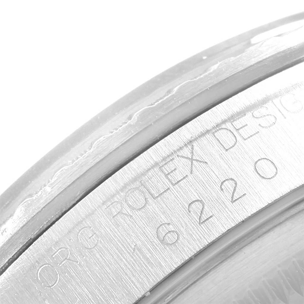 This close-up photo shows the side engraving on the case of a Rolex Datejust 16220 Men's Stainless Steel Grey Dial 16220 Men's Stainless Steel Grey Dial model, including part of the model number.