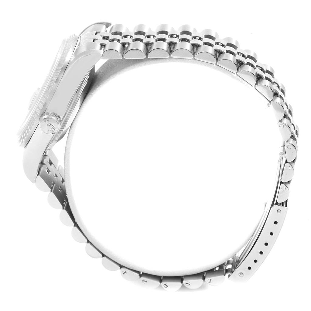 The image shows a side view of the Rolex Datejust 16220 Men's Stainless Steel Grey Dial 16220 Men's Stainless Steel Grey Dial watch, focusing on the crown, case, and stainless steel bracelet.