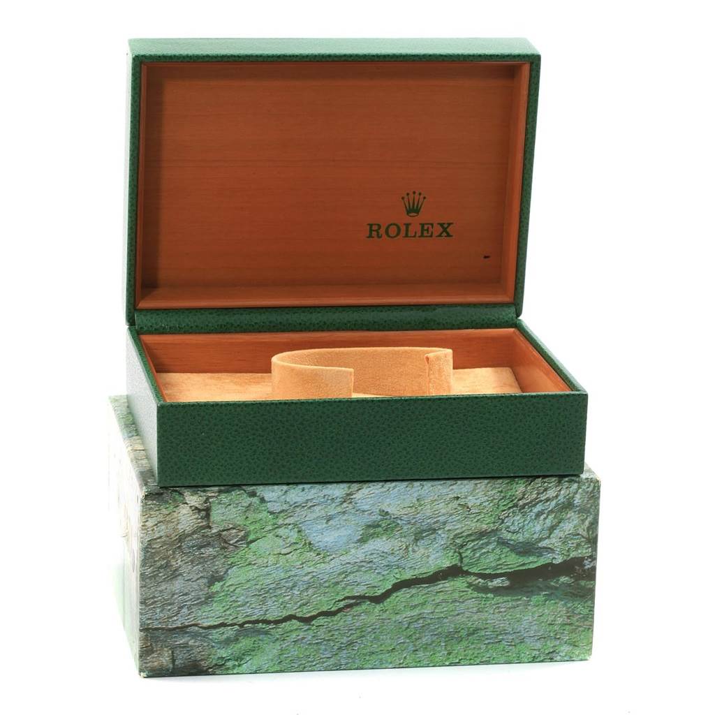 The image shows an open, empty green Rolex Datejust 16220 Men's Stainless Steel Grey Dial 16220 Men's Stainless Steel Grey Dial box with a beige cushion inside.