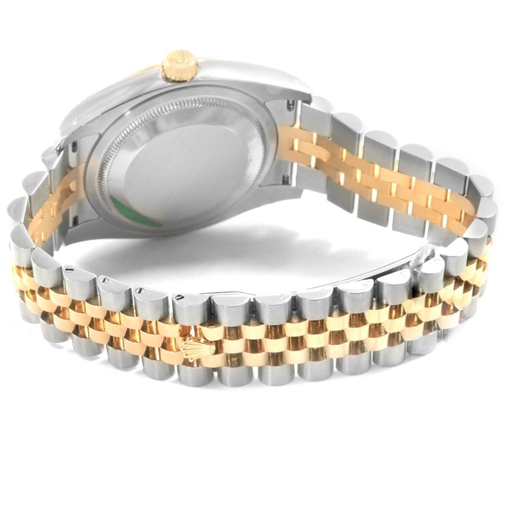 The image shows the back and bracelet of a Rolex Datejust 116233 Men's Steel and Gold (two tone) Mother of Pearl Dial 116233 Men's Steel and Gold (two tone) Mother of Pearl Dial watch, highlighting its clasp and crown.