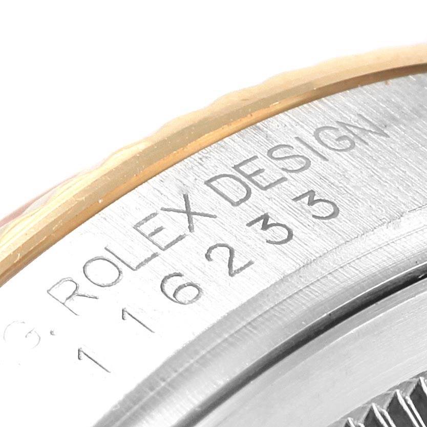 The image shows a close-up of the edge and markings on the side of a Rolex Datejust 116233 Men's Stainless Steel Silver Dial 116233 Men's Stainless Steel Silver Dial watch case.