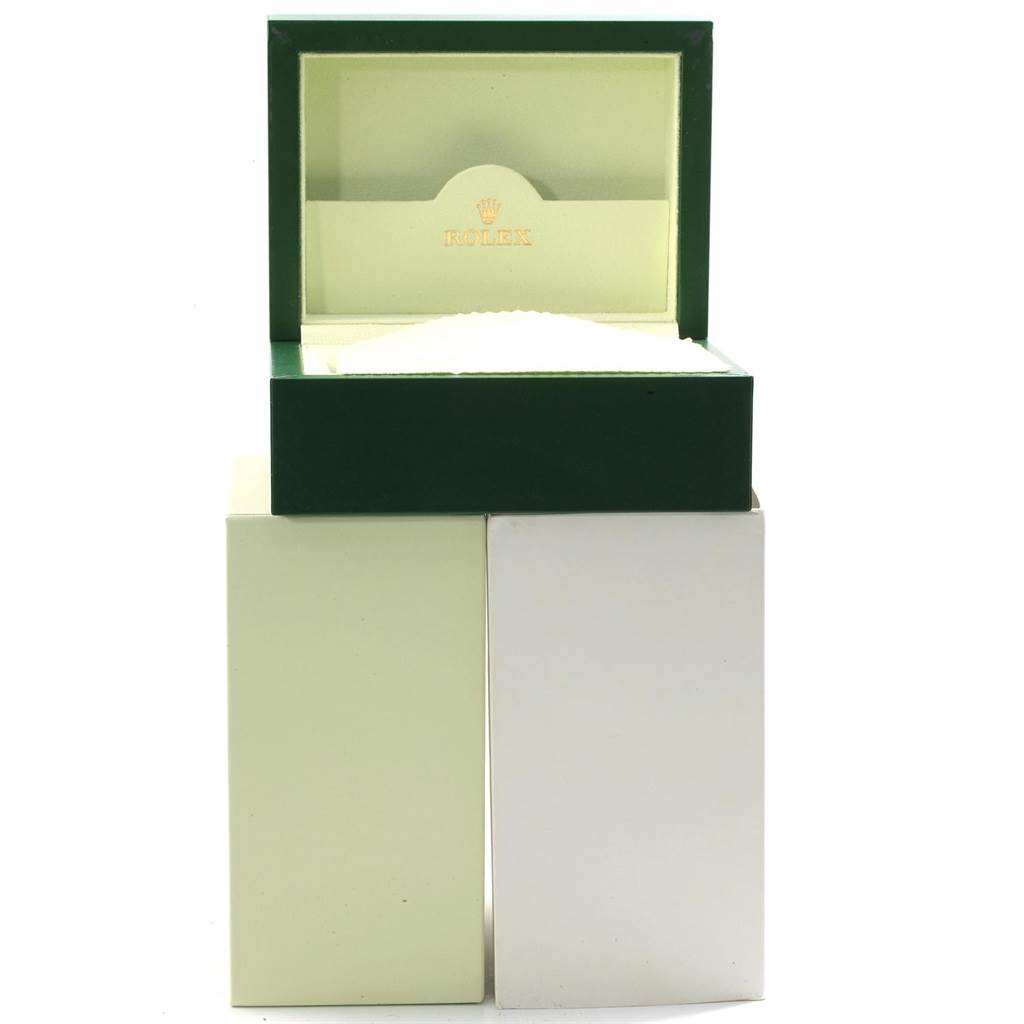 This image shows an open green and cream box for a Rolex Datejust 116233 Men's Stainless Steel Silver Dial 116233 Men's Stainless Steel Silver Dial watch, revealing the interior with the Rolex logo.