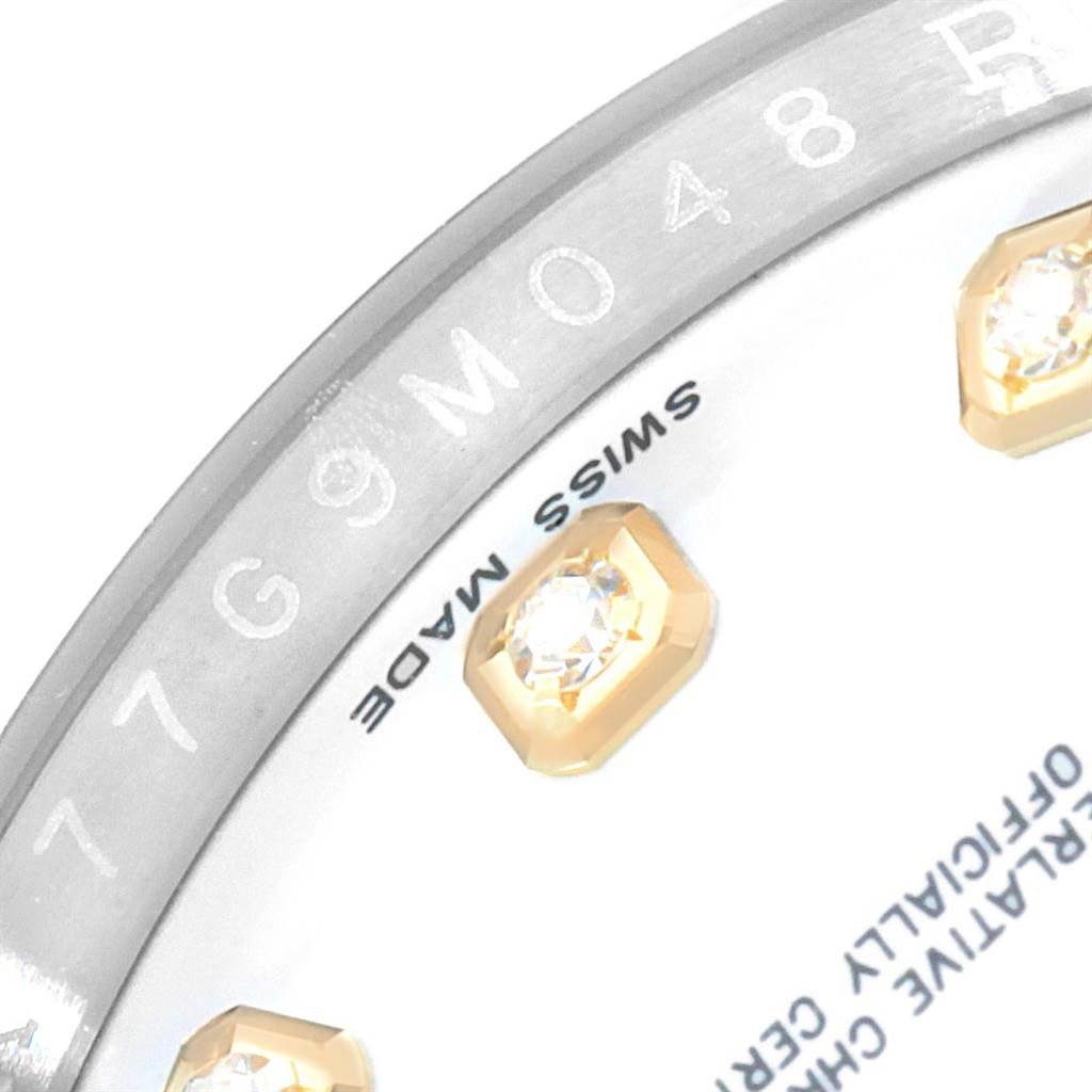 This image shows a close-up of the inner bezel and part of the dial with diamond markers of a Rolex Datejust 116233 Men's Stainless Steel White Dial 116233 Men's Stainless Steel White Dial watch.