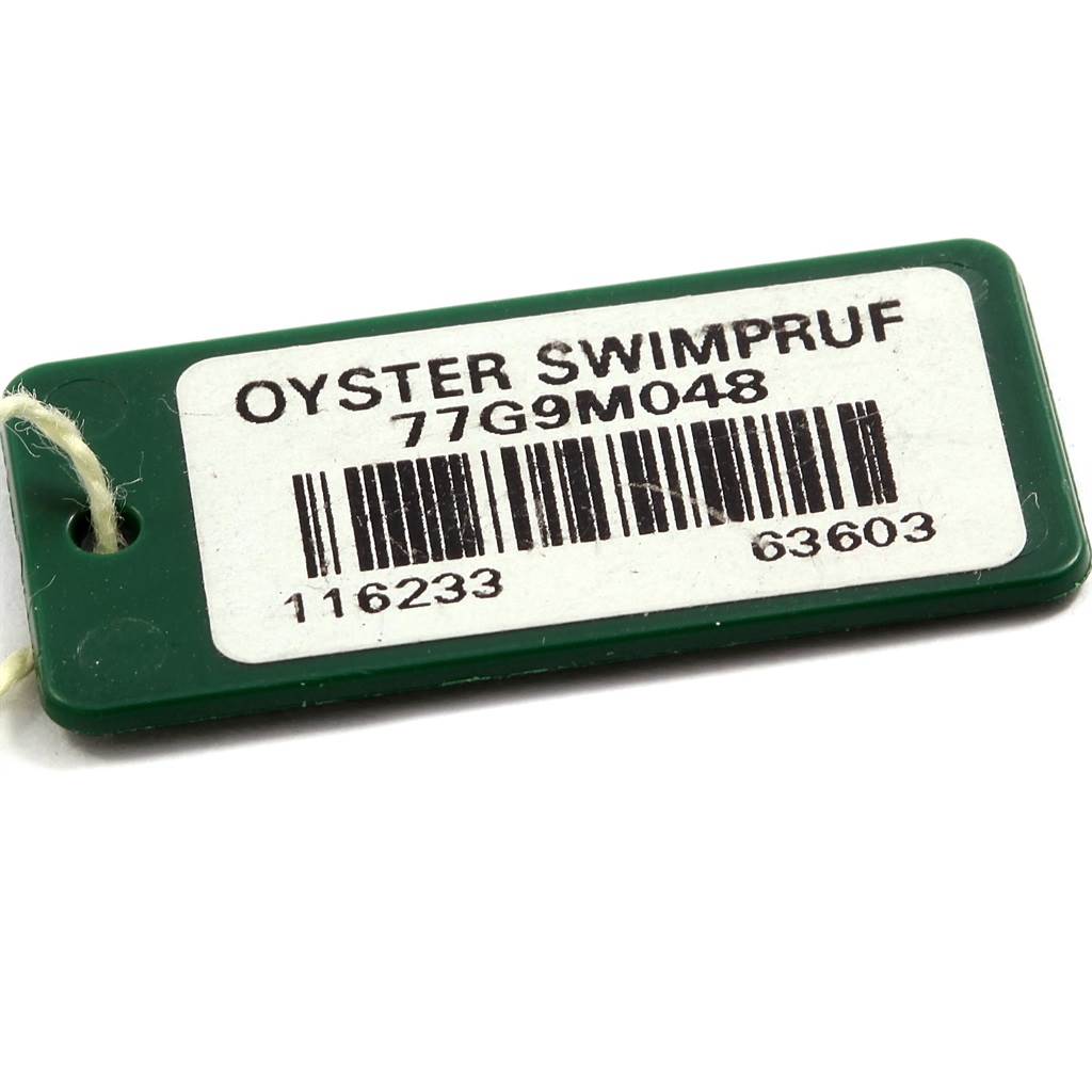 This image shows a green Oyster Swimpruf tag with a barcode and serial number for a Rolex Datejust 116233 Men's Stainless Steel White Dial 116233 Men's Stainless Steel White Dial watch.
