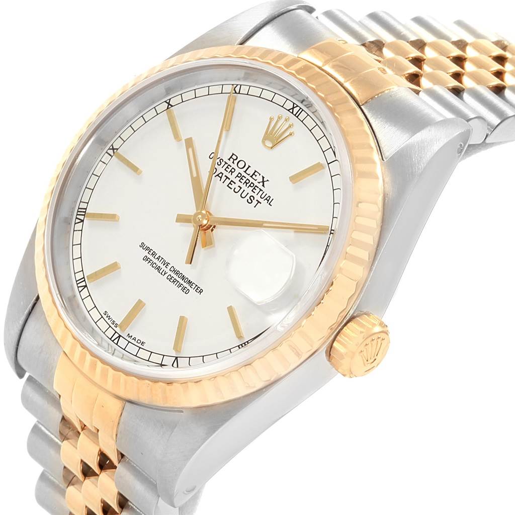 The image shows a Rolex Datejust 16233 Men
s Steel and Gold (two tone) White Dial 16233 Men
s Steel and Gold (two tone) White Dial watch at a slight angle, highlighting its white dial, fluted bezel, and two-tone bracelet.
