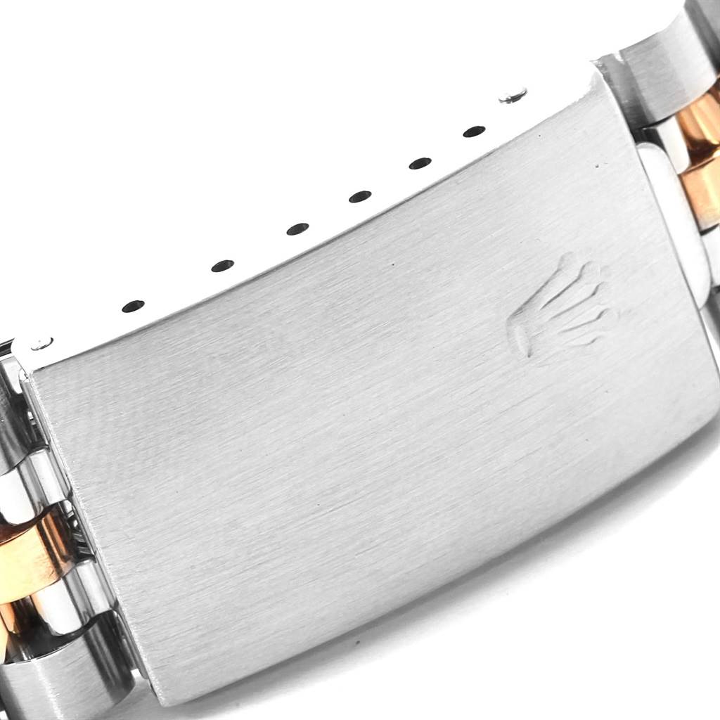 This image shows a close-up shot of the clasp and part of the bracelet of a Rolex Datejust 16233 Men's Steel and Gold (two tone) Champagne Dial 16233 Men's Steel and Gold (two tone) Champagne Dial watch.