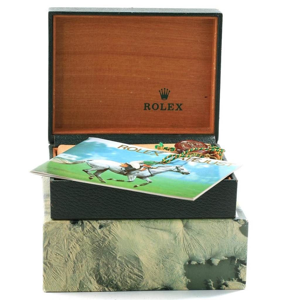 The image shows a Rolex Datejust 16200 Men's Stainless Steel Blue Dial 16200 Men's Stainless Steel Blue Dial watch box, partially open, with a booklet and tag on top.