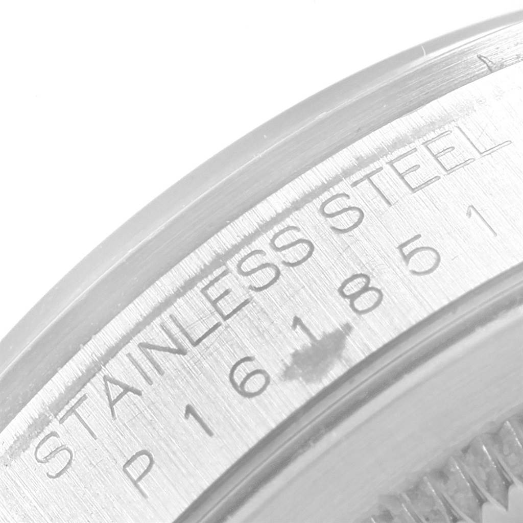 This image shows a close-up of the stainless steel outer rim and serial number of a Rolex Datejust 16200 Men's Stainless Steel Blue Dial 16200 Men's Stainless Steel Blue Dial watch.