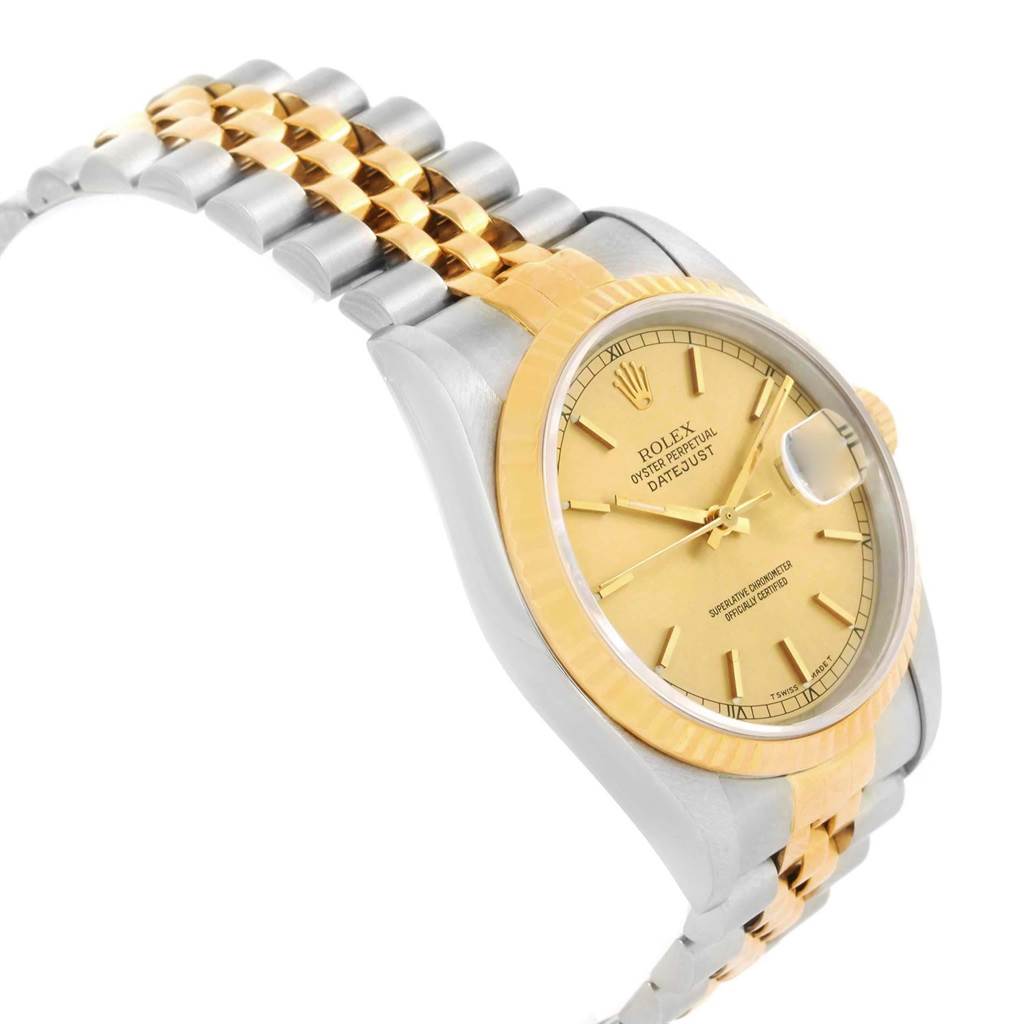 This image shows a Rolex Datejust 16233 Men's Steel and Gold (two tone) Champagne Dial 16233 Men's Steel and Gold (two tone) Champagne Dial watch at an angle highlighting its face, bezel, and two-tone bracelet.