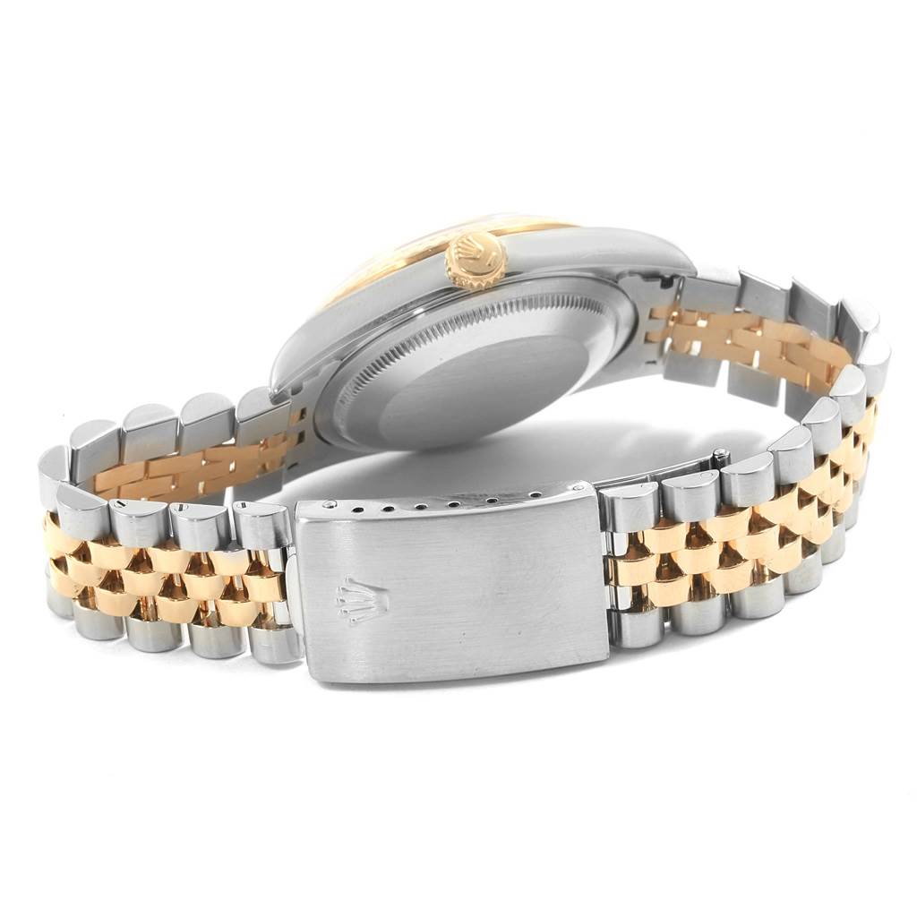 This image shows the back case, crown, and Jubilee bracelet of a Rolex Datejust 16233 Men's Steel and Gold (two tone) Champagne Dial 16233 Men's Steel and Gold (two tone) Champagne Dial watch.