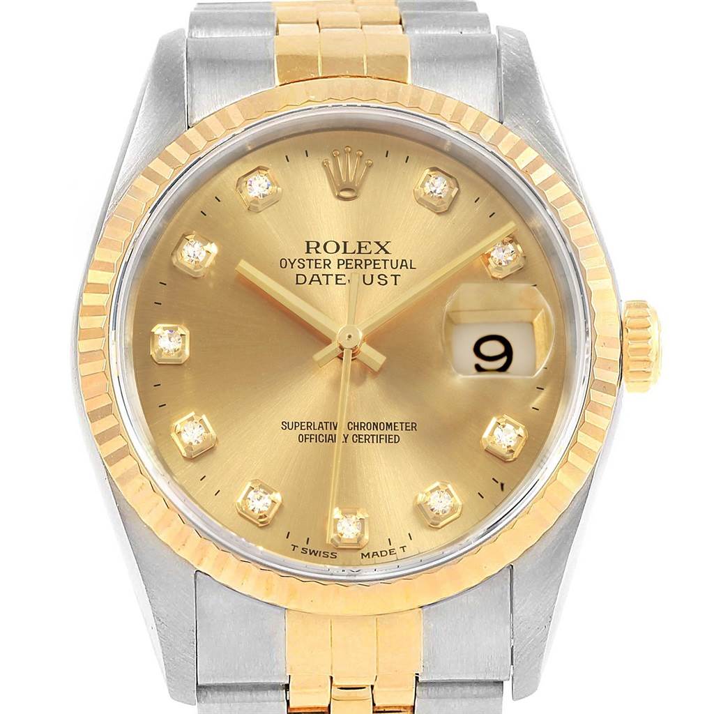 This is a frontal view of a Rolex Datejust 16233 Men's Steel and Gold (two tone) Champagne Dial 16233 Men's Steel and Gold (two tone) Champagne Dial watch with a two-tone gold and silver design and a gold dial with diamond hour markers.