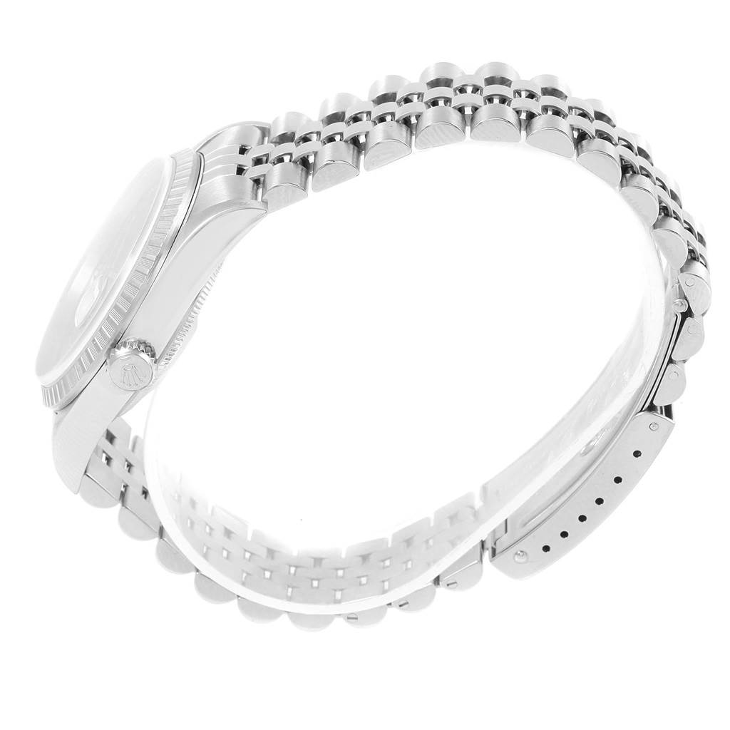 This image shows a side view of a Rolex Datejust 16220 Men's Stainless Steel Blue Dial 16220 Men's Stainless Steel Blue Dial watch, highlighting the crown, case, and bracelet.