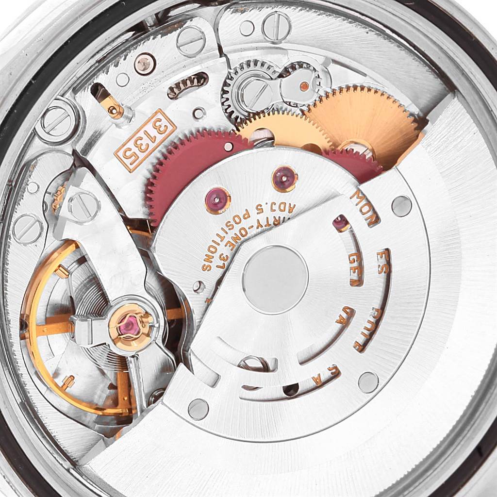 This image shows the intricate movement and inner mechanical parts of a Rolex Datejust 16220 Men's Stainless Steel Blue Dial 16220 Men's Stainless Steel Blue Dial watch.