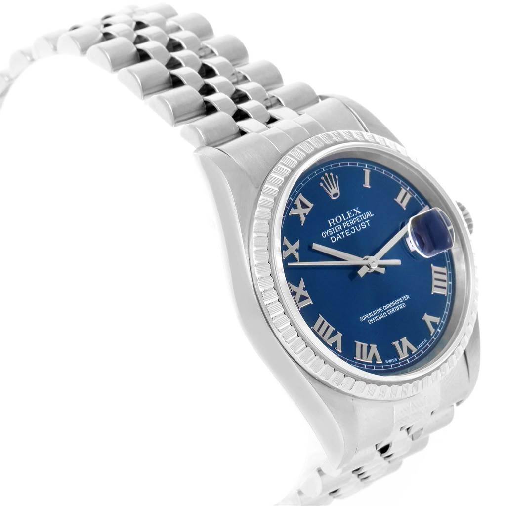 The image shows a Rolex Datejust 16220 Men's Stainless Steel Blue Dial 16220 Men's Stainless Steel Blue Dial watch from an angled side view, highlighting its blue dial, Jubilee bracelet, and fluted bezel.
