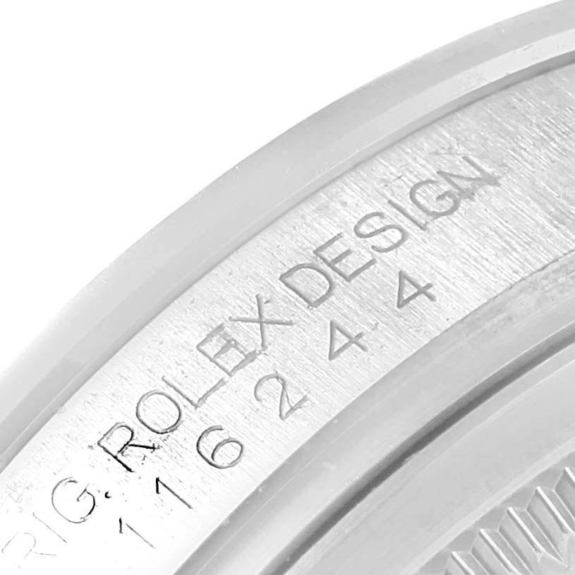 The image shows a close-up of the model number engraving on the bezel of a Rolex Datejust 116244 Men's Stainless Steel Black Dial 116244 Men's Stainless Steel Black Dial watch.