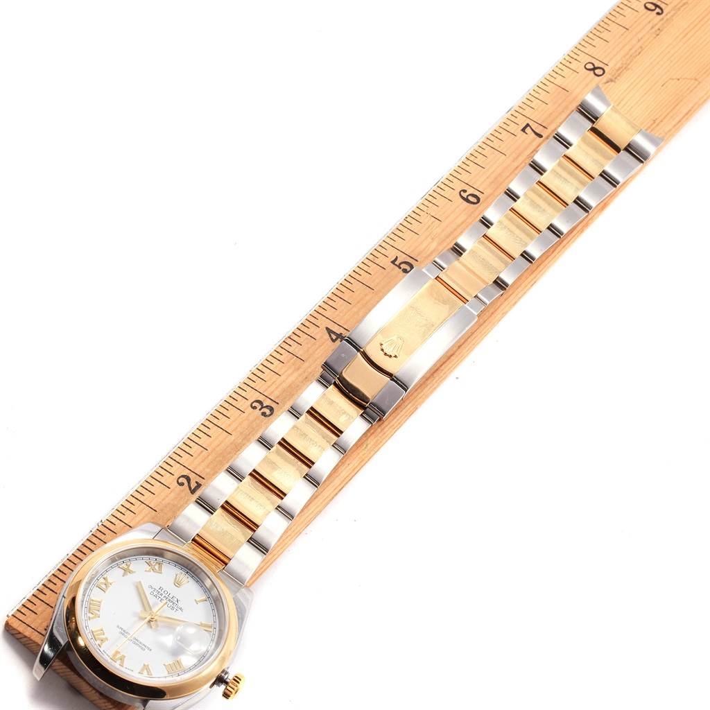 The image shows a top view of a Rolex Datejust 116203 Men's Stainless Steel White Dial 116203 Men's Stainless Steel White Dial watch, displaying its face, bezel, and bracelet along a measuring ruler.