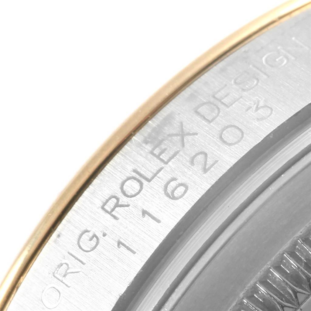 The image shows a close-up of the engraved casing edge of a Rolex Datejust 116203 Men's Stainless Steel White Dial 116203 Men's Stainless Steel White Dial watch, displaying part of its model number.