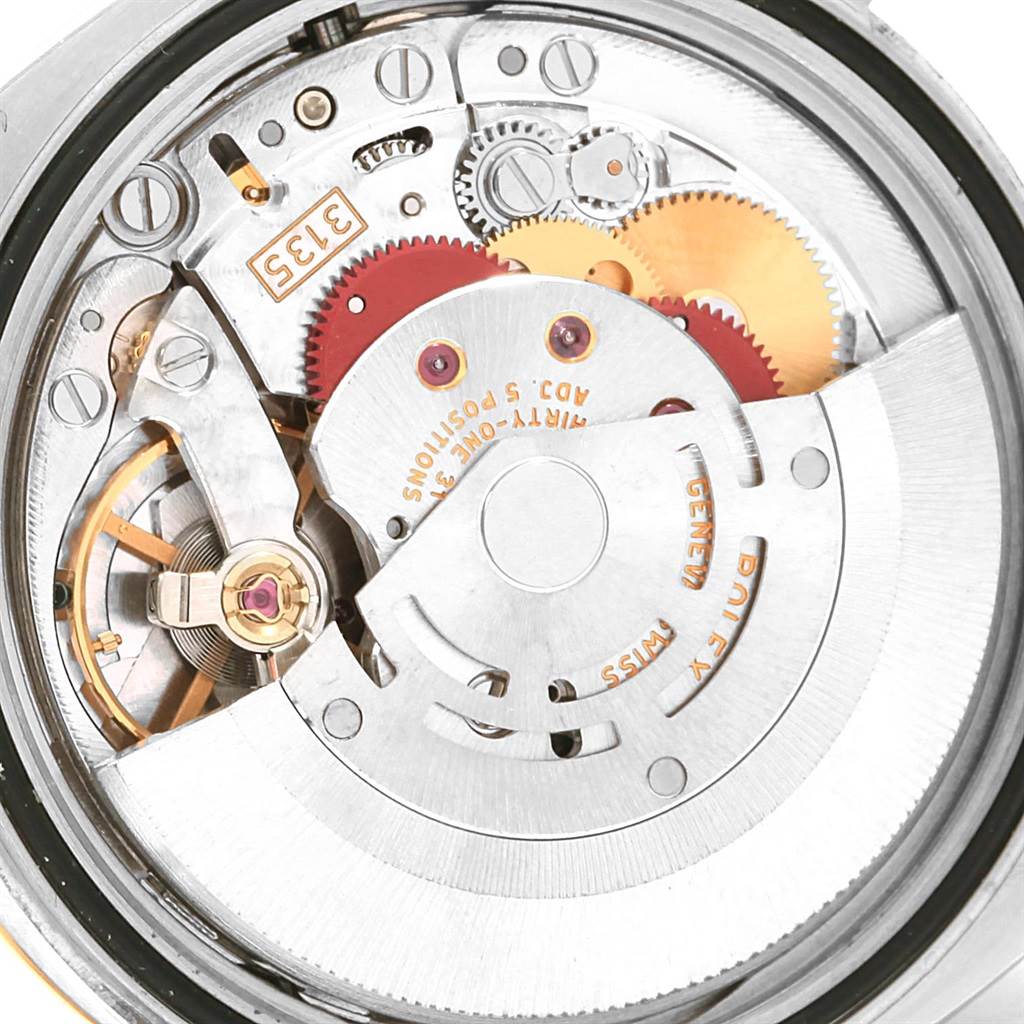 This is a close-up of the Rolex Datejust 116203 Men's Stainless Steel White Dial 116203 Men's Stainless Steel White Dial watch movement, displaying the intricate gears and internal mechanisms.