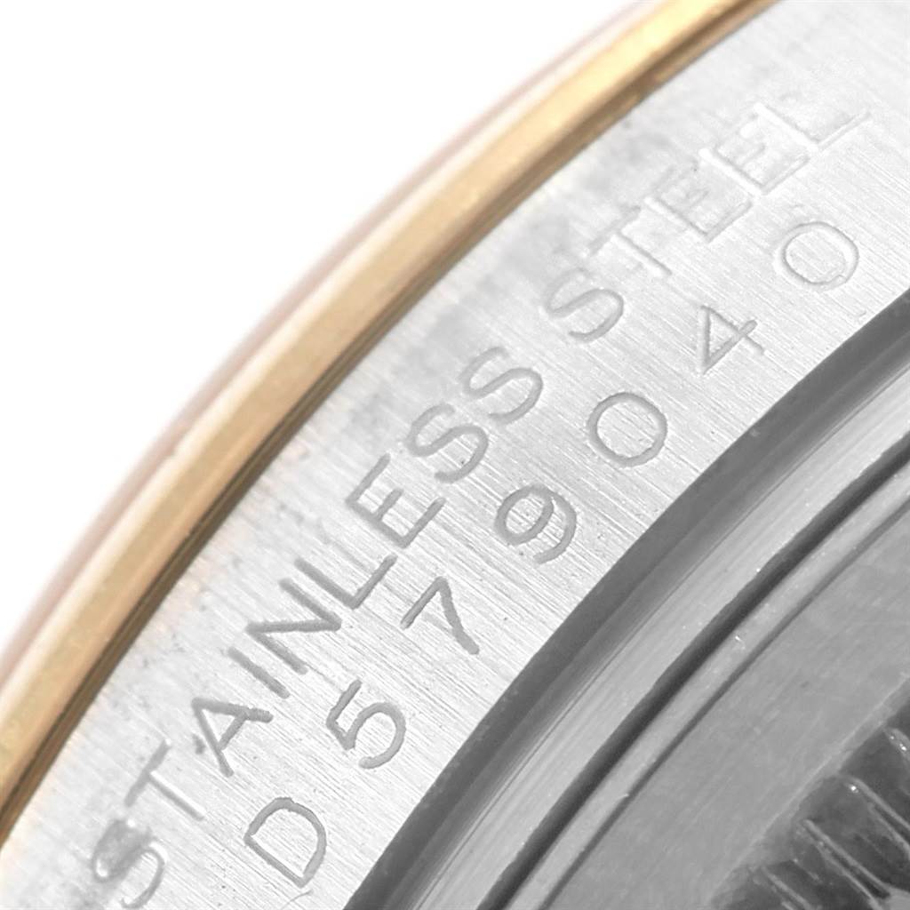 The image shows a close-up of the engraved serial number and "Stainless Steel" text on the bezel of a Rolex Datejust 116203 Men's Stainless Steel White Dial 116203 Men's Stainless Steel White Dial watch.