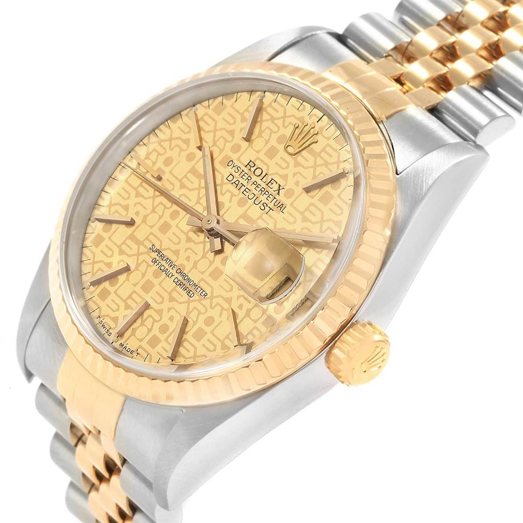 This angled view of the Rolex Datejust 16233 Men's Steel and Gold (two tone) Champagne Dial 16233 Men's Steel and Gold (two tone) Champagne Dial watch shows the dial, bezel, crown, and part of the two-tone bracelet.
