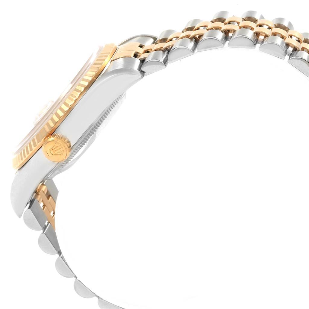 The image shows a side view of the Rolex Datejust 16233 Men's Steel and Gold (two tone) Champagne Dial 16233 Men's Steel and Gold (two tone) Champagne Dial, highlighting the fluted bezel, crown, and part of the jubilee bracelet.