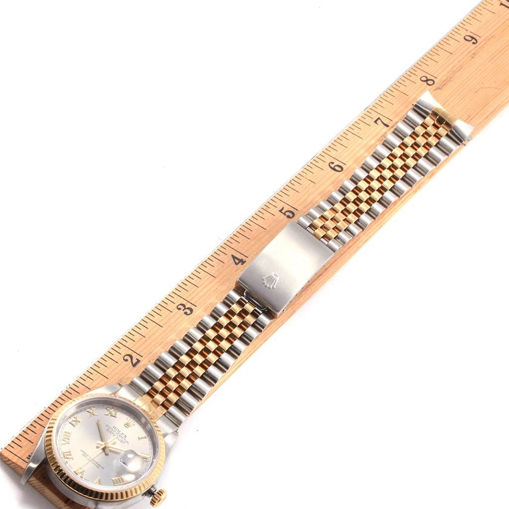 The image shows a Rolex Datejust 16233 Men's Steel and Gold (two tone) Grey Dial 16233 Men's Steel and Gold (two tone) Grey Dial watch laid flat, displaying the dial, bezel, and two-tone Jubilee bracelet beside a ruler.