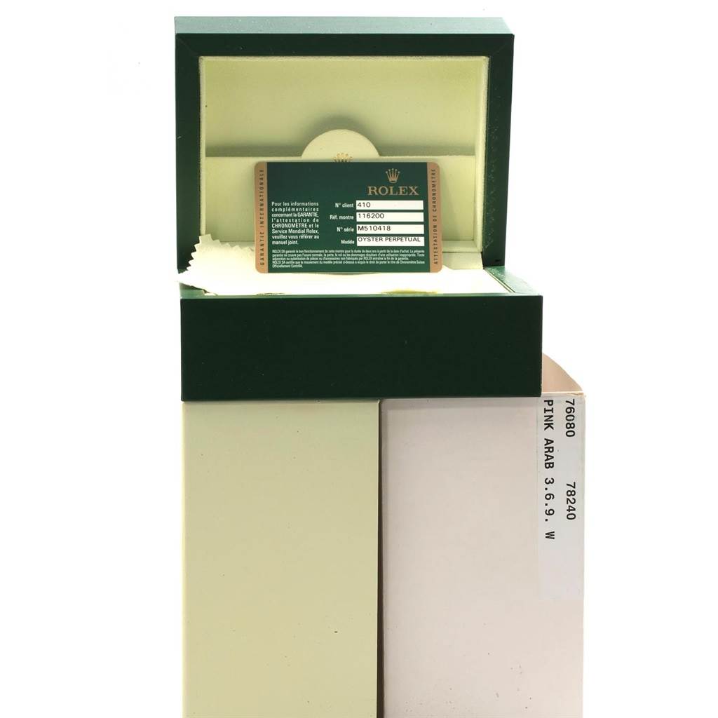 This image shows a green Rolex Datejust 116200 Men's Stainless Steel Black Dial 116200 Men's Stainless Steel Black Dial box with an authenticity card inside, viewed from the front.