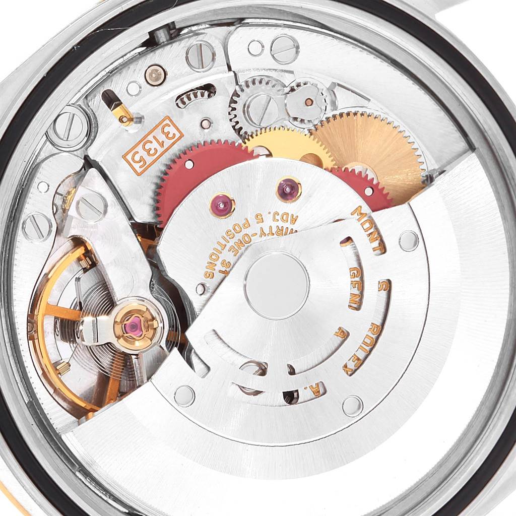 This image shows the internal mechanical movement of a Rolex Datejust 16233 Steel and Gold (two tone) Champagne Dial 16233 Steel and Gold (two tone) Champagne Dial watch, highlighting gears and components from a rear view angle.
