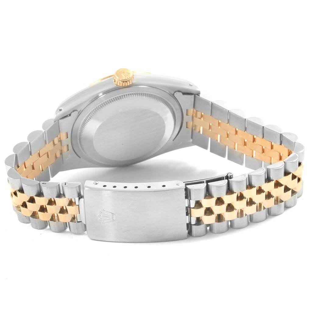This image shows the back view of a Rolex Datejust 16233 Steel and Gold (two tone) Champagne Dial 16233 Steel and Gold (two tone) Champagne Dial watch, highlighting the case back, crown, and two-tone bracelet.