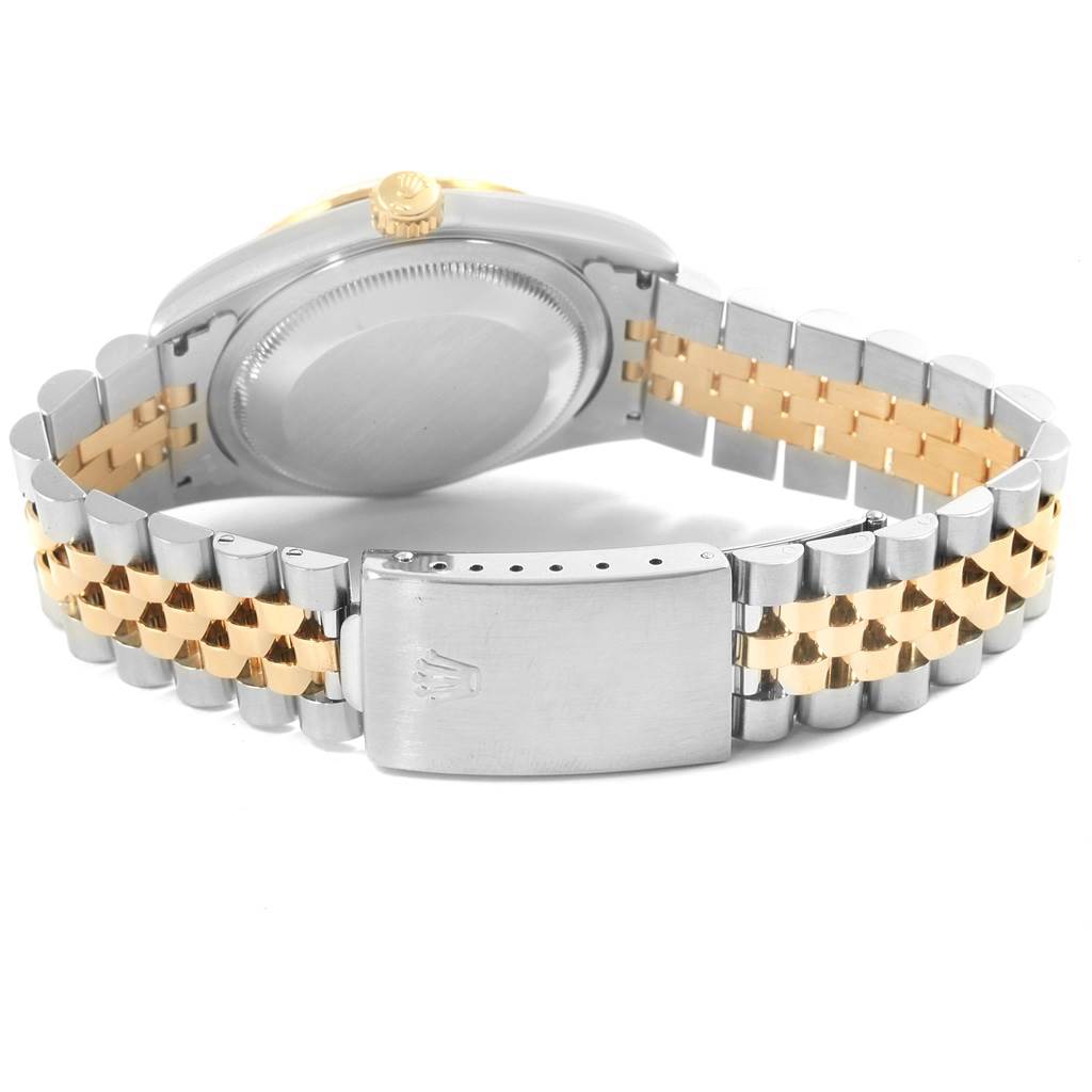 This image shows the back view of a Rolex Datejust 16233 Men's Steel and Gold (two tone) Champagne Dial 16233 Men's Steel and Gold (two tone) Champagne Dial watch, highlighting its case back, crown, and two-tone bracelet with clasp.