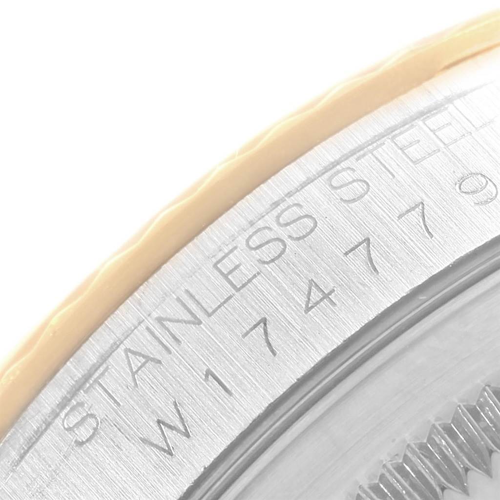 The image shows a close-up of the serial number engraving on the stainless steel bezel of a Rolex Datejust 16233 Men's Steel and Gold (two tone) Champagne Dial 16233 Men's Steel and Gold (two tone) Champagne Dial watch.