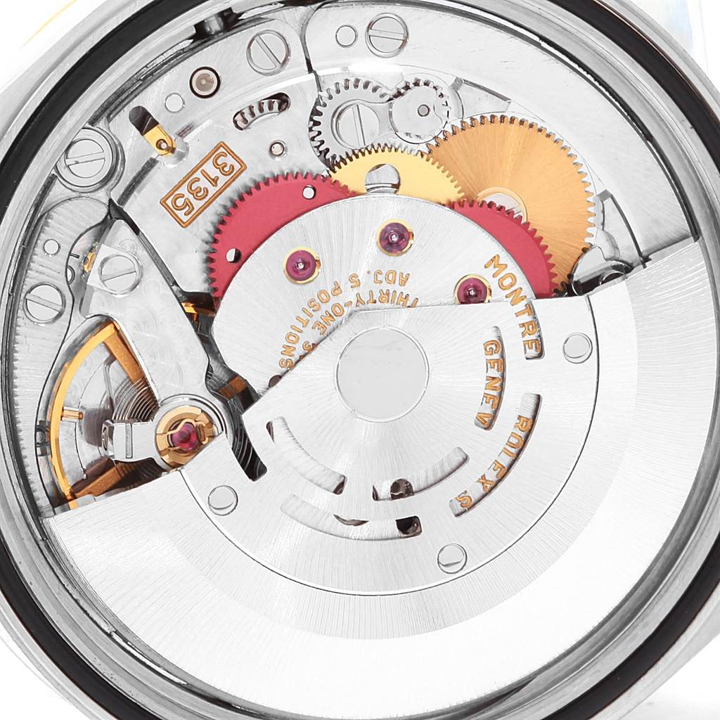 This image shows the intricate inner mechanism and gears of a Rolex Datejust 16233 Men's Steel and Gold (two tone) Champagne Dial 16233 Men's Steel and Gold (two tone) Champagne Dial model watch, viewed from the back.
